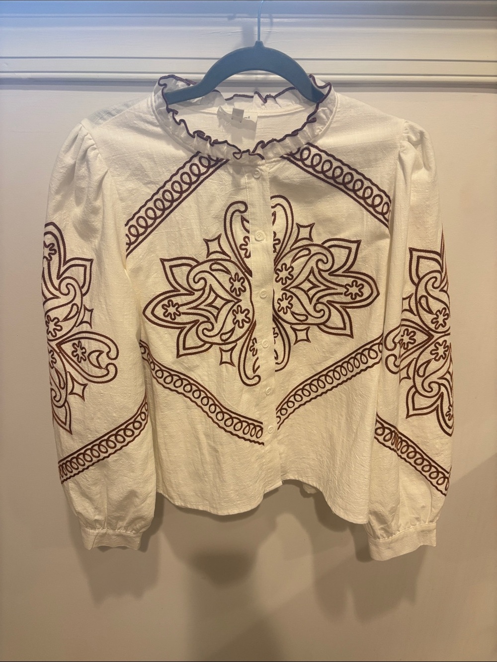 White Long-Sleeve Embroidered Button-Up Blouse with Brown Motif